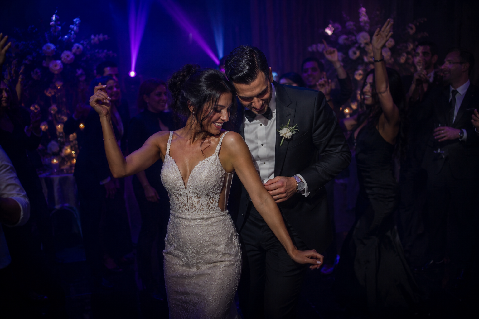 A wedding reception dance floor lit for the first dance